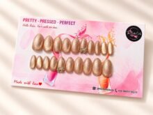 Champagne press-on nails by The Belle Coats, twenty nails on a card